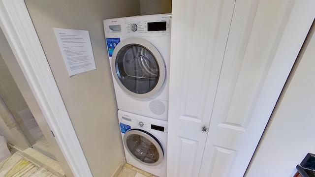 laundry room featuring stacked washer / dryer