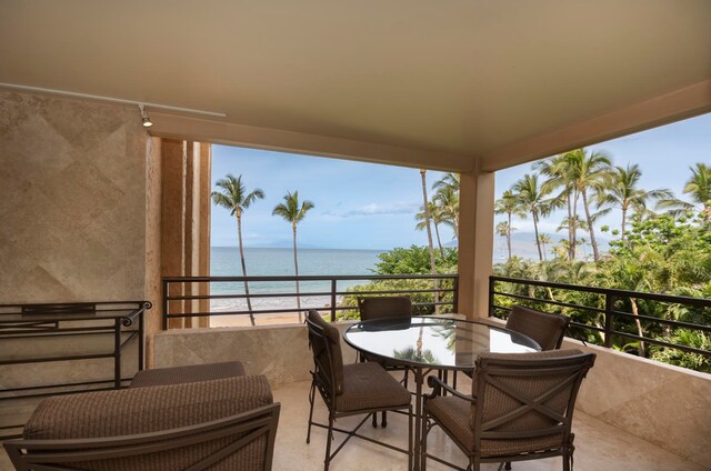 balcony featuring a water view