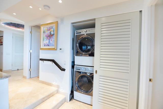 laundry area with stacked washer / dryer