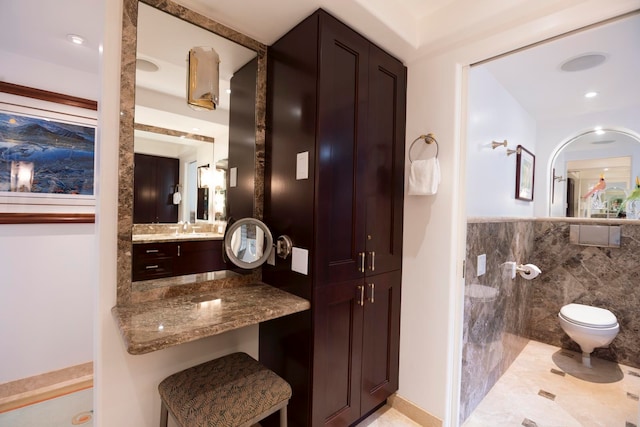 bathroom featuring a shower, toilet, and vanity