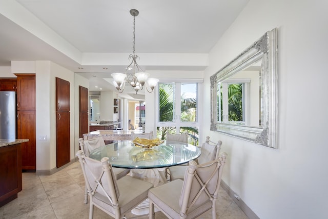 dining room with recessed lighting, light tile patterned floors, baseboards, and an inviting chandelier