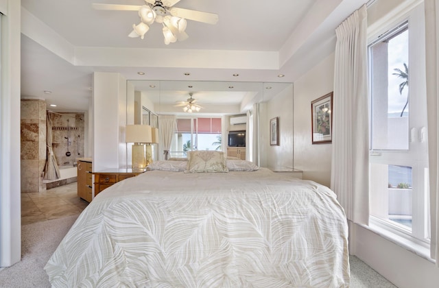 bedroom with an AC wall unit, a tray ceiling, carpet floors, and recessed lighting