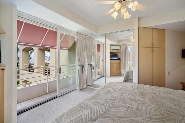 bedroom featuring access to outside, ceiling fan, carpet, and a wall mounted AC