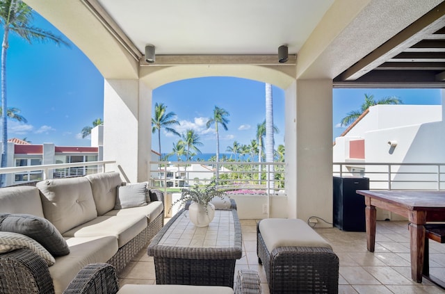 view of patio / terrace with a balcony and outdoor lounge area