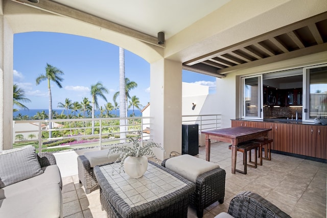 view of patio featuring a balcony and outdoor lounge area