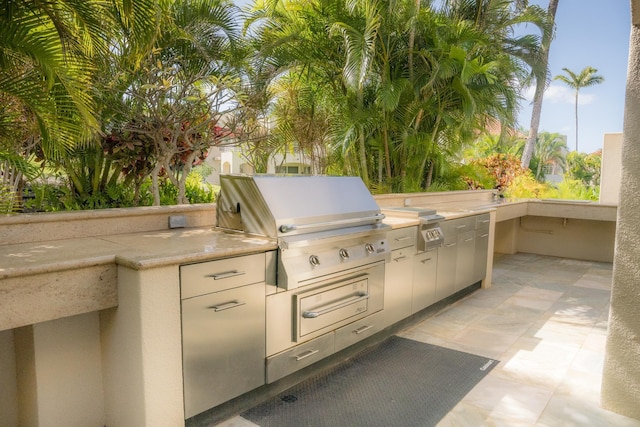 view of patio with a grill and exterior kitchen