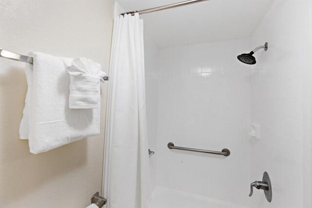 bathroom with a shower with shower curtain