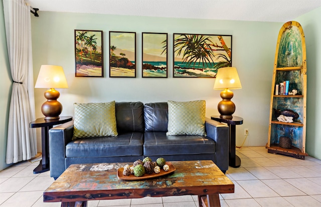 living room featuring a textured ceiling and light tile patterned floors