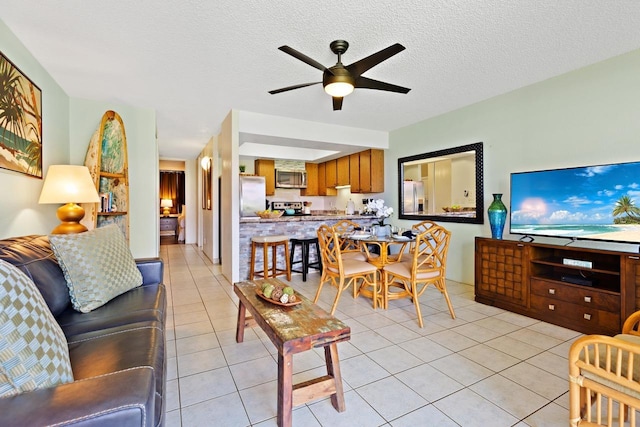 tiled living room with ceiling fan and a textured ceiling