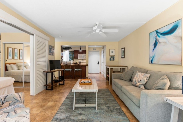 living room with ceiling fan