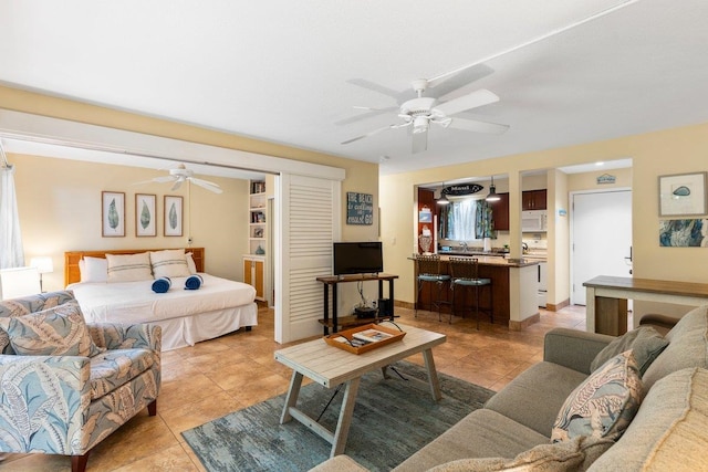 bedroom with light tile patterned flooring and ceiling fan