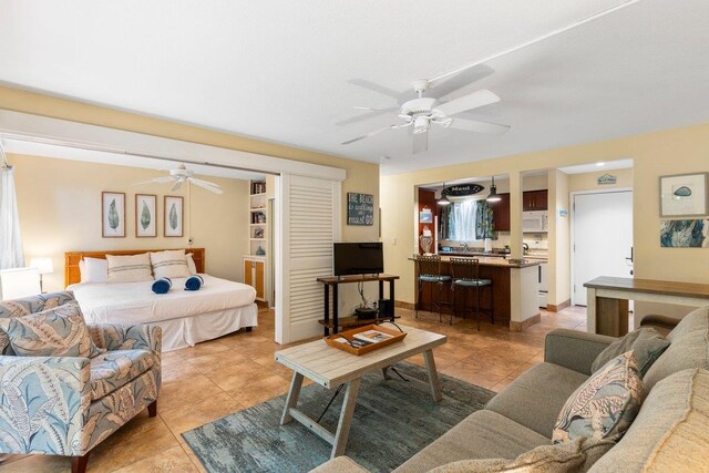 280 Hauoli Rd Unit A16, Wailuku, HI 96793 - bedroom with light tile patterned floors and a ceiling fan