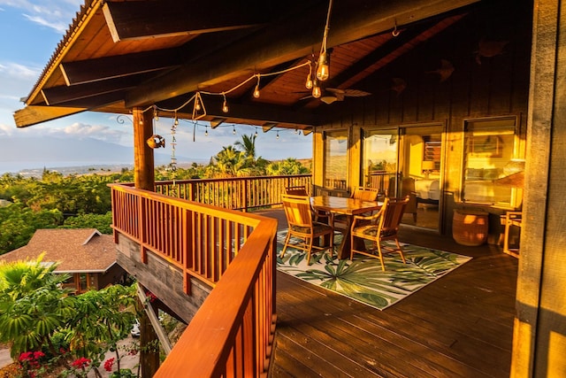 wooden deck featuring ceiling fan