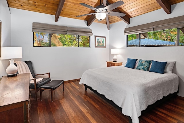 bedroom with wood ceiling, ceiling fan, multiple windows, dark hardwood / wood-style floors, and beamed ceiling