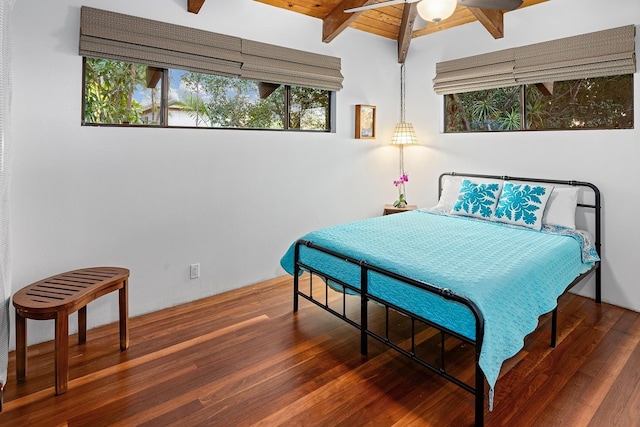 bedroom featuring lofted ceiling with beams, dark wood-type flooring, wooden ceiling, and ceiling fan