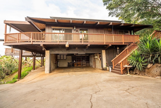 view of front facade with a carport and a deck