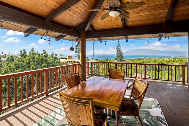 wooden terrace with a gazebo, a mountain view, and ceiling fan