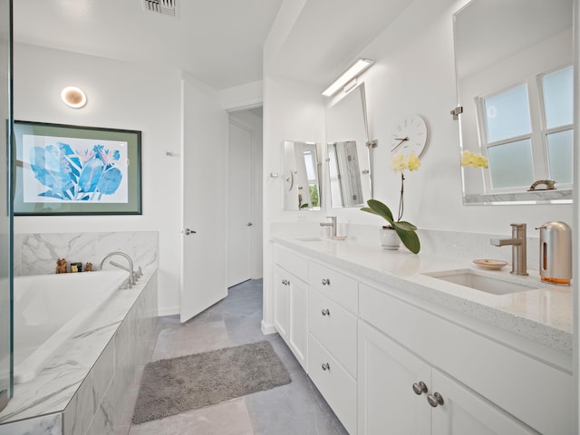 137 Hoohale St, Kihei, HI 96753 - full bath featuring visible vents, double vanity, a garden tub, and a sink