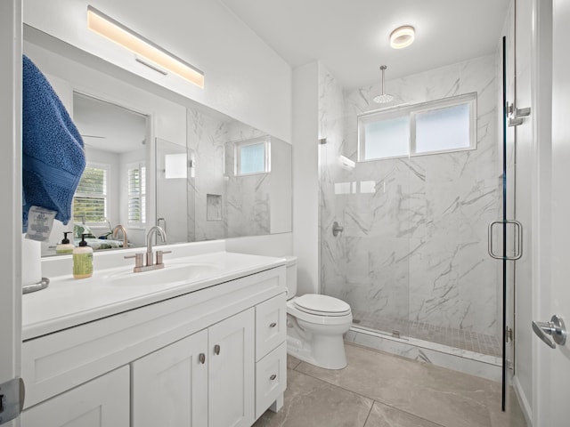 137 Hoohale St, Kihei, HI 96753 - full bathroom featuring toilet, vanity, a marble finish shower, and a wealth of natural light