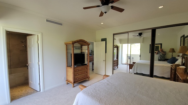 carpeted bedroom with a closet and ceiling fan