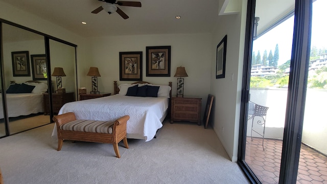 carpeted bedroom with a closet and ceiling fan