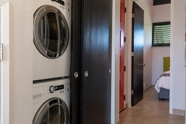 laundry room with stacked washer / dryer