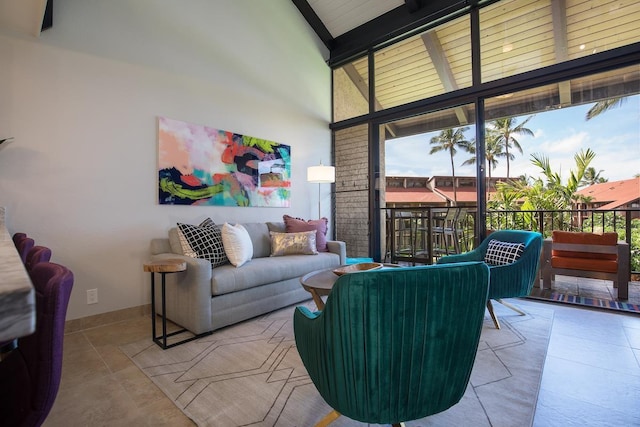 living room with beamed ceiling and high vaulted ceiling