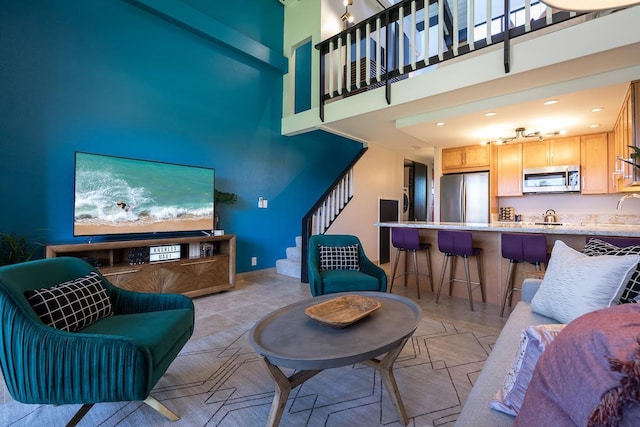 living room featuring a towering ceiling