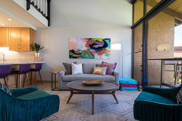 living room with plenty of natural light and a high ceiling