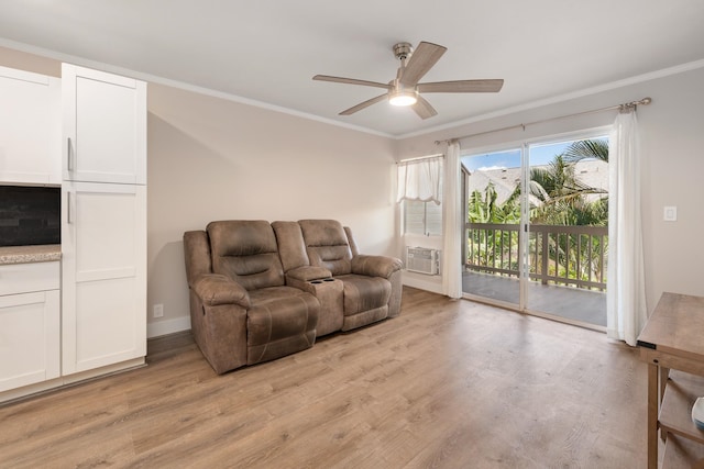 living room featuring cooling unit, ornamental molding, ceiling fan, and light hardwood / wood-style floors