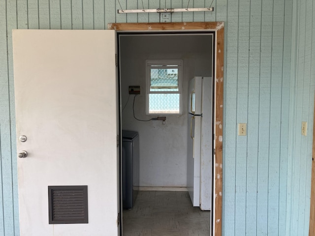 hall featuring visible vents and washer / clothes dryer