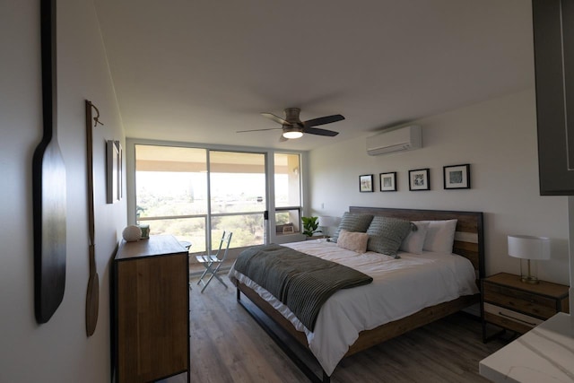 bedroom featuring dark hardwood / wood-style flooring, ceiling fan, expansive windows, and a wall mounted AC