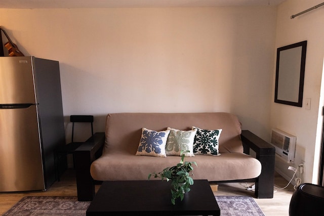 living room featuring wood finished floors and heating unit