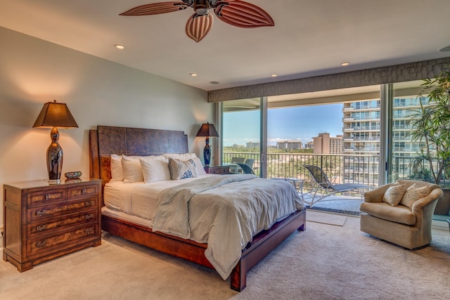 bedroom with access to exterior and light carpet