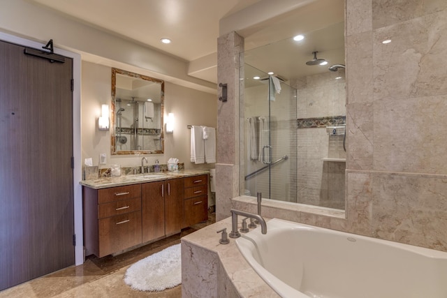 bathroom with vanity and separate shower and tub