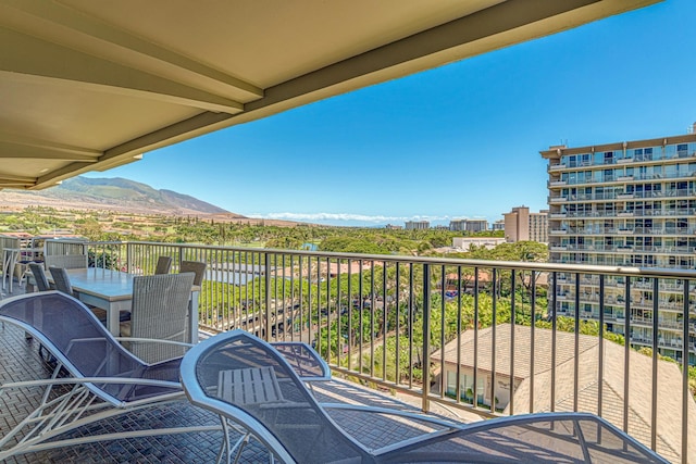 balcony featuring a mountain view