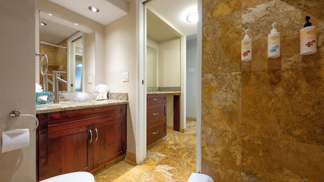 bathroom with vanity and tile floors