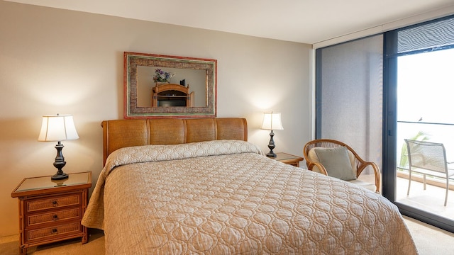 bedroom featuring carpet, access to outside, and multiple windows