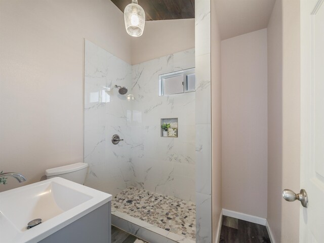 145 W Kane St, Kahului, HI 96732 - bathroom featuring toilet, wood-type flooring, sink, and tiled shower
