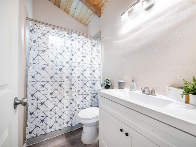 bathroom with toilet, vanity, vaulted ceiling with beams, hardwood / wood-style flooring, and wood ceiling