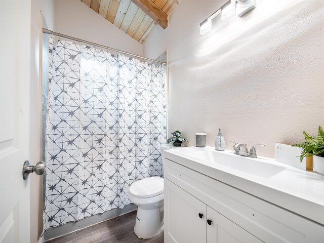 145 W Kane St, Kahului, HI 96732 - bathroom with toilet, vanity, vaulted ceiling with beams, hardwood / wood-style flooring, and wood ceiling