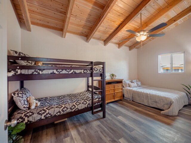 bedroom featuring dark wood-type flooring, ceiling fan, wooden ceiling, and lofted ceiling with beams