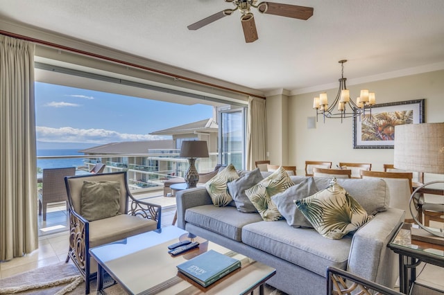 living room featuring ceiling fan with notable chandelier, a water view, crown molding, and light tile patterned floors