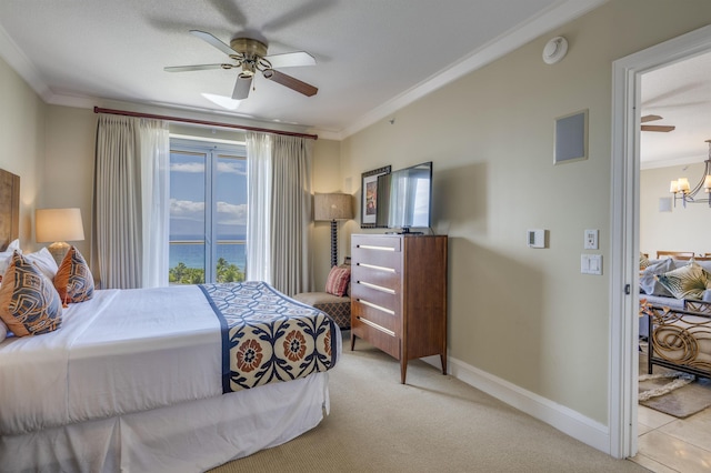 bedroom featuring ceiling fan with notable chandelier, baseboards, crown molding, and light colored carpet