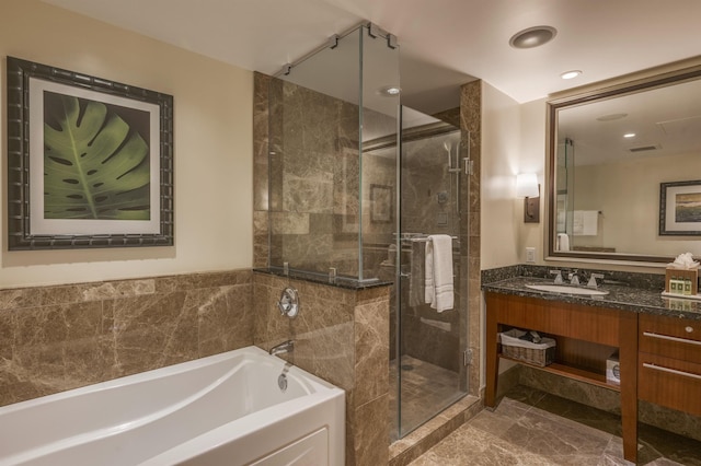 full bathroom with a garden tub, recessed lighting, vanity, marble finish floor, and a stall shower