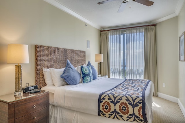 bedroom with a ceiling fan, baseboards, crown molding, and light colored carpet