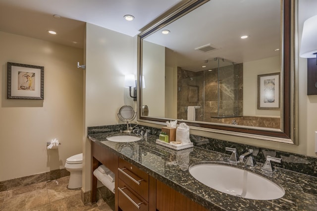 full bathroom featuring visible vents, a sink, toilet, and double vanity