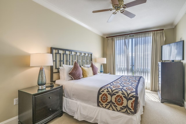 bedroom featuring ceiling fan, light colored carpet, and crown molding