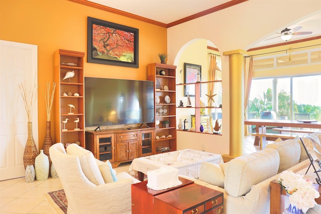 living room featuring light tile patterned floors, ornamental molding, and ceiling fan