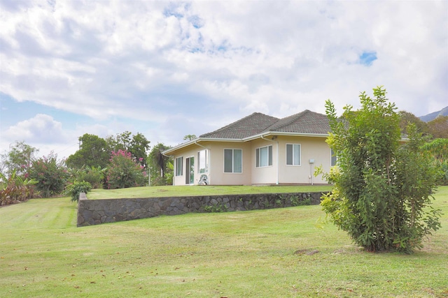 view of home's exterior featuring a lawn